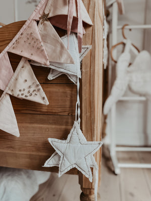 Jewelled and quilted bunting decor in offwhite