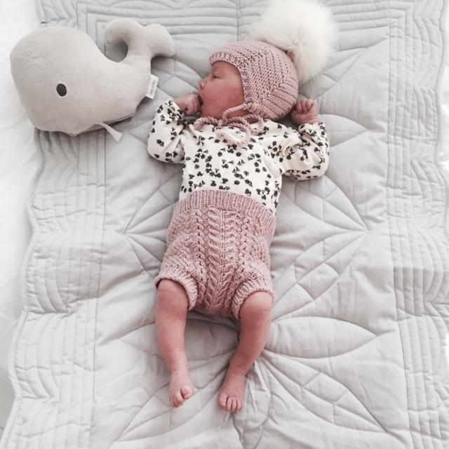 baby girl on mist grey changing mat