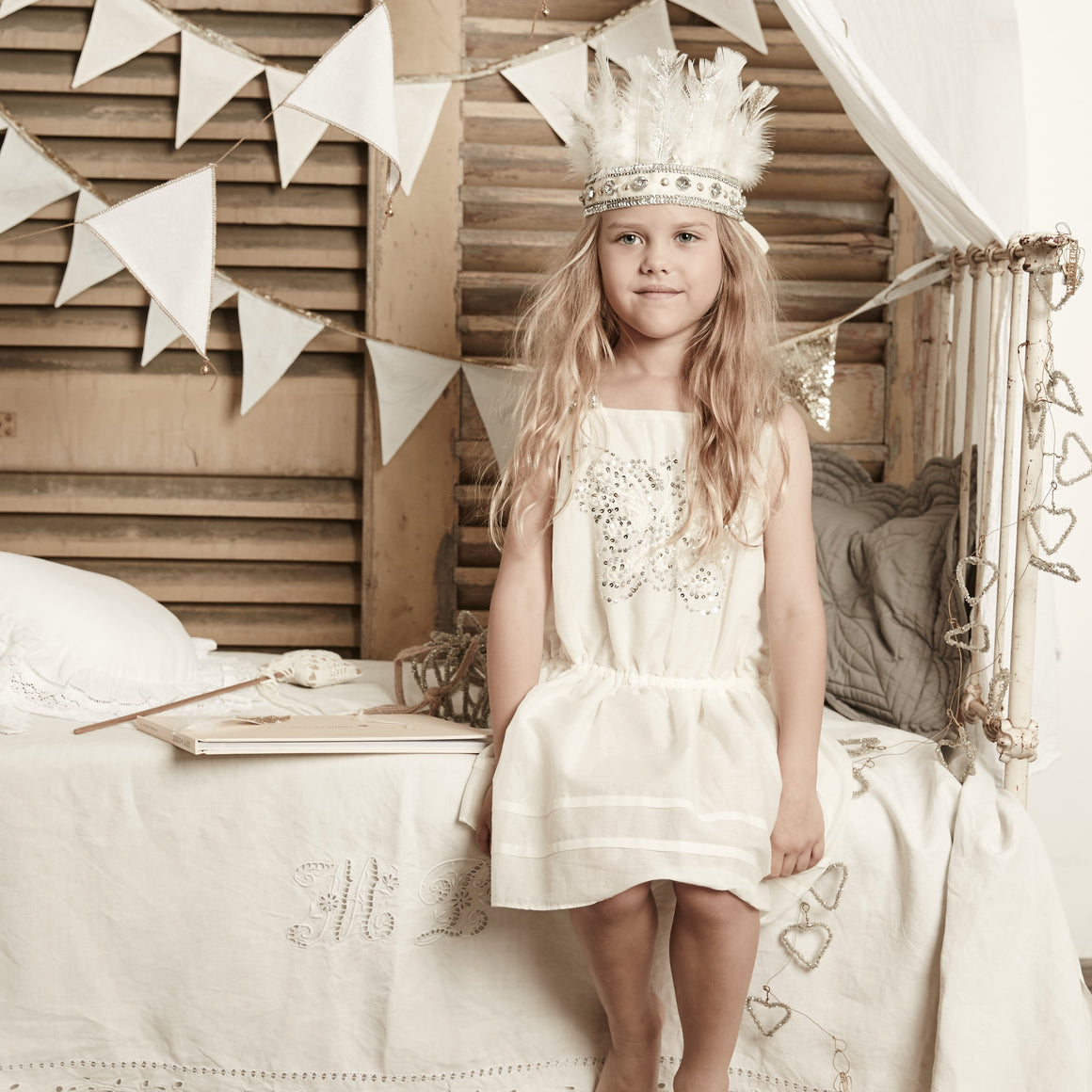 girl wearing bonne mere sequin butterfly dress