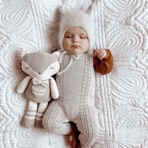 baby boy sleeping on baby play mat