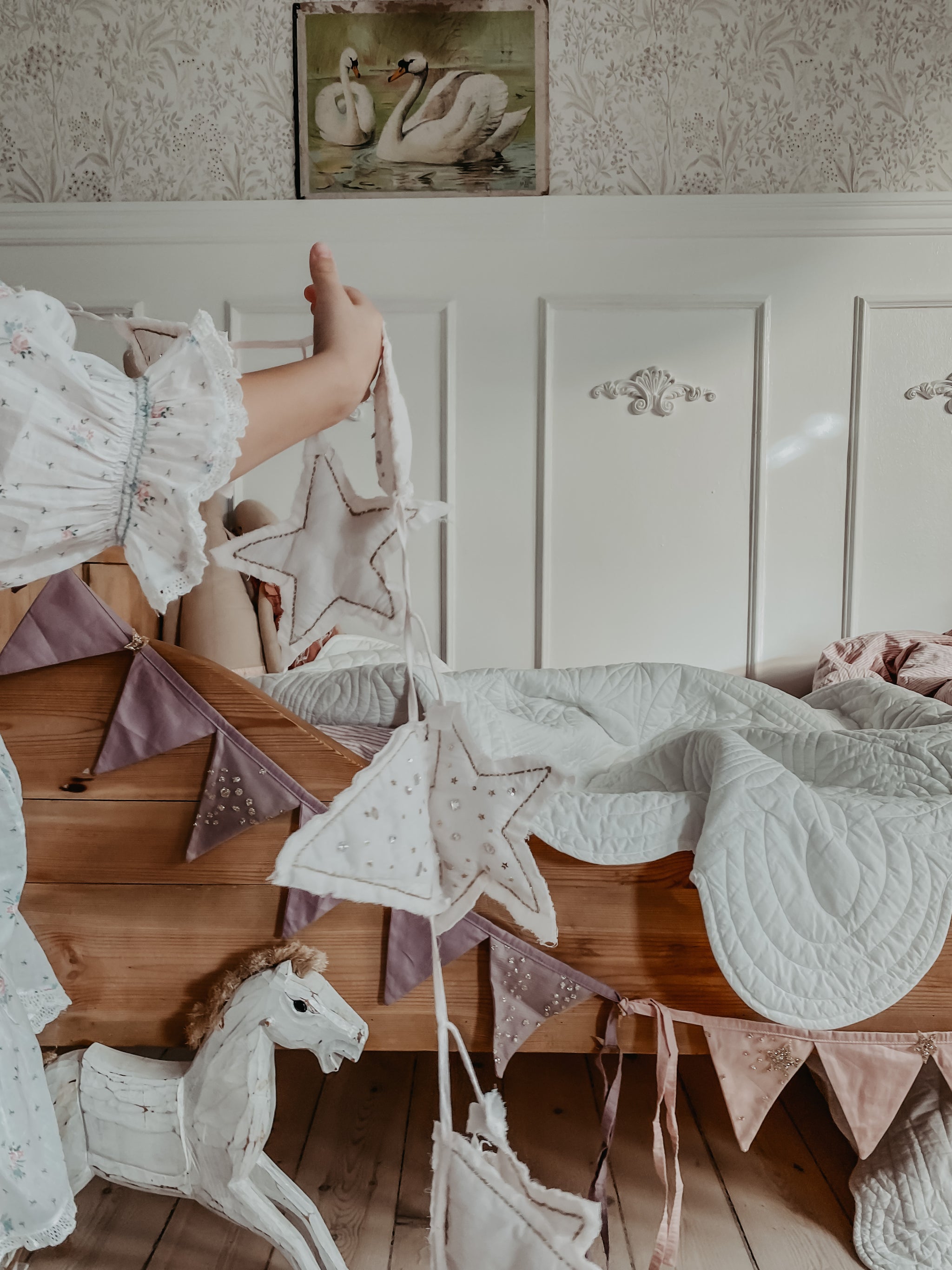 Jewelled and quilted bunting decor in offwhite